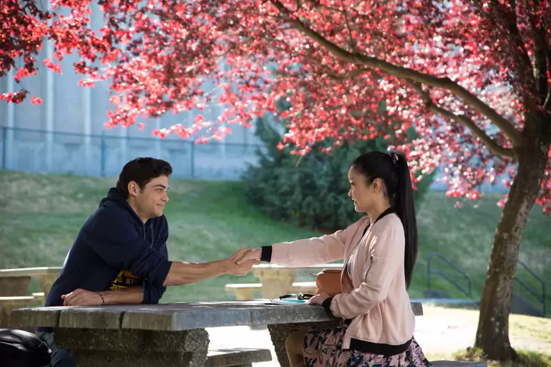 A charming shot from "All the Boys I've Loved Before": Lara Jean Covey and Peter Kavinsky share a sweet moment in the high school hallway, capturing the film's delightful blend of romance and teenage nostalgia. #ToAllTheBoys