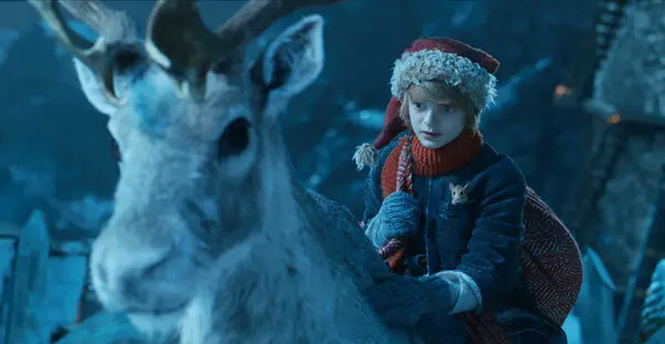 "Captivating snapshot from 'A Boy Called Christmas' movie: A young boy embarks on a magical adventure, surrounded by enchanting winter landscapes and whimsical characters. Immerse yourself in the heartwarming tale of hope and wonder."