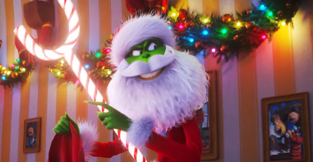 The Grinch Movie: A green, furry Grinch with a mischievous grin standing on Mount Crumpit, plotting to steal Christmas. Whimsical Whoville scenes, heartwarming moments, and a holiday journey of redemption."