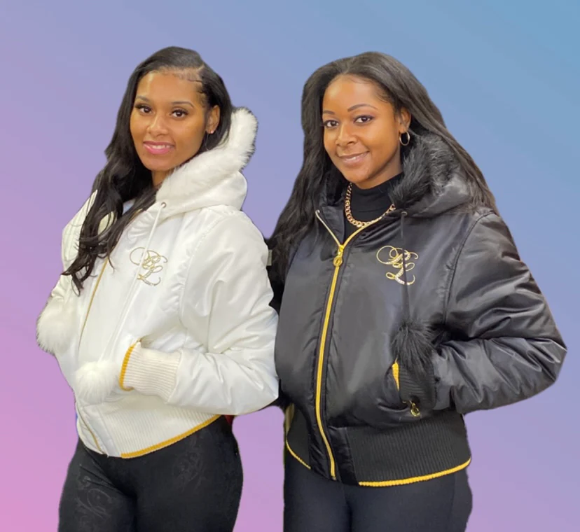 A person wearing a fashionable Baby Phat jacket.